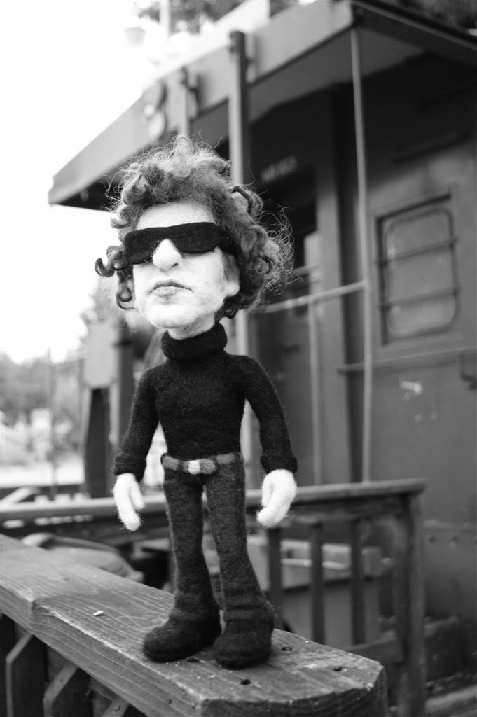 Bob Dylan's needle felted doppelganger on the back of a train.